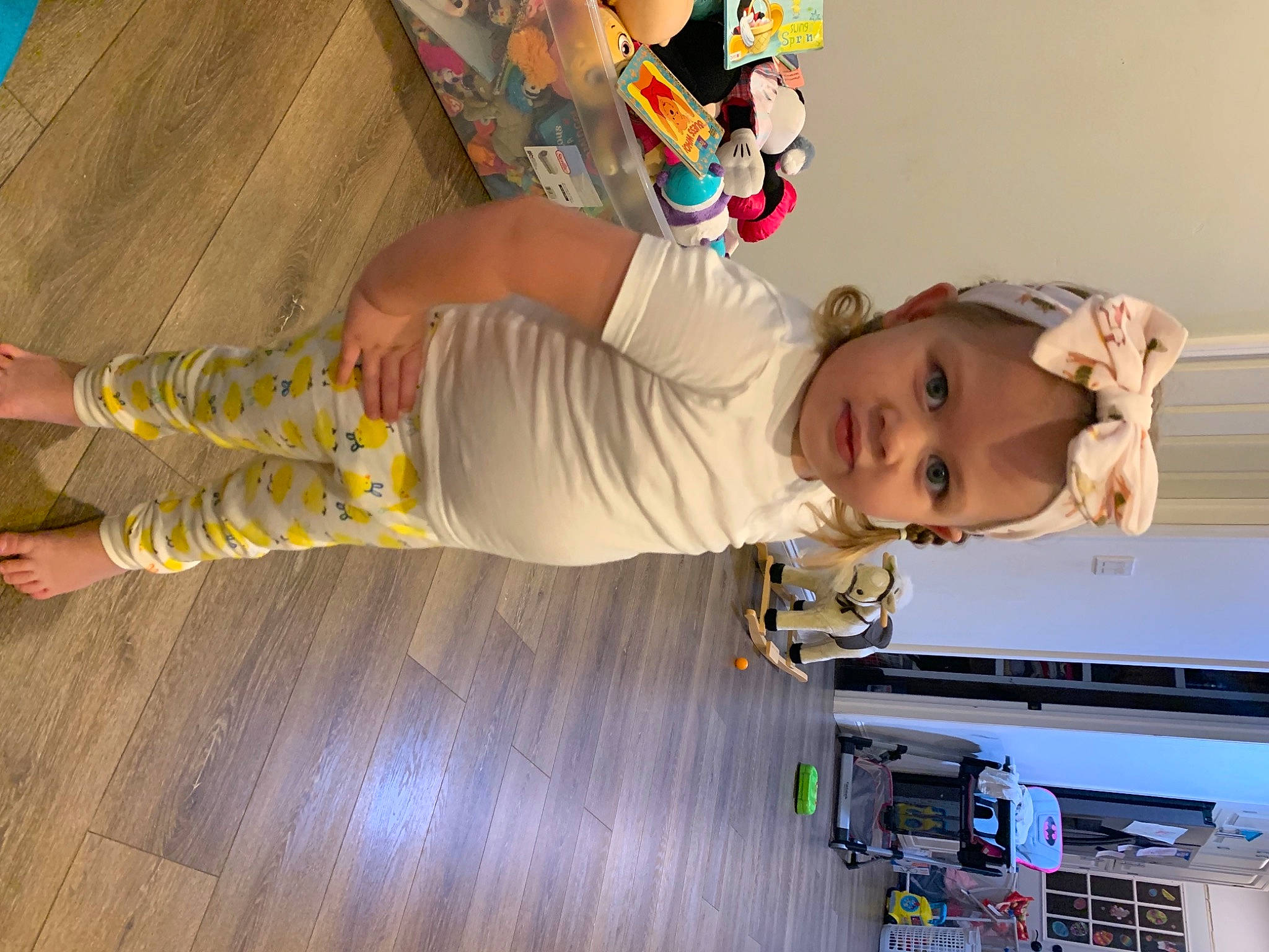 Avianna joined the competition — help win amazing prizes! baby, baby_toddler_clothing, child, flooring, foot, fun, hardwood, hat, human_leg, joint, knee, machine, person, product, room, smile, t_shirt, thigh, toddler, wood