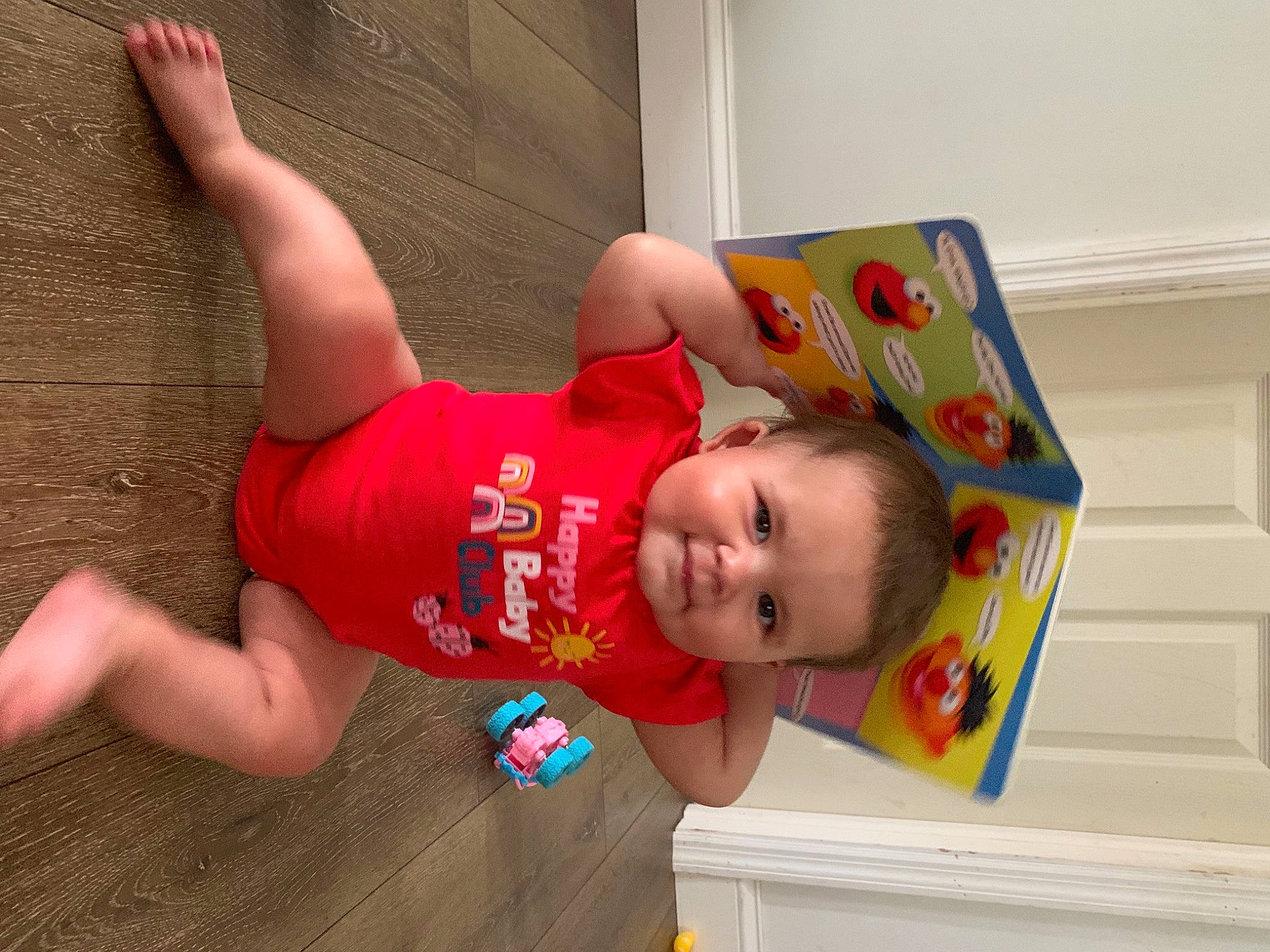 Genesis is registered to the contest to win money with this photo: arm, baby, baby_toddler_clothing, child, event, flooring, fun, happy, human_leg, leisure, party, person, play, room, shorts, smile, sock, t_shirt, thigh, toddler