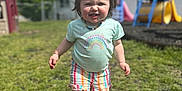Madi joined the competition — help win amazing prizes! child, colorful, daylight, fence, grass, hair, happy, house, outdoor, person, play, playground, shoes, shorts, smiling, summer, sunny, toddler, tshirt, walking