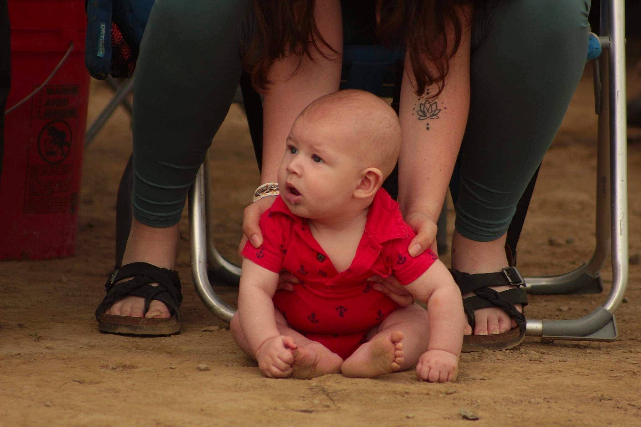 Bailey joined the competition — help win amazing prizes! baby, calf, dress, floor, flooring, foot, fun, grass, happy, human_leg, joint, knee, leg, leisure, person, shoe, sneakers, surprise, thigh, toddler