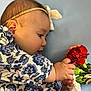 baby, blue_background, bouquet, child, clothing, colorful, cute, face, floral_pattern, flower, hand, headband, infant, laying_down, nature, peaceful, portrait, skin, soft_light, young_child