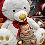 baby, child, childhood, cozy_clothing, cute, festive, happy, holiday_decor, indoor, joy, knitwear, plush_toy, red_bow, shopping_cart, smiling, soft_texture, store, stuffed_animal, teddy_bear, toy_store