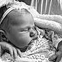 Kaelyn is registered to the contest to win money with this photo: newborn, baby, sleeping, headband, pearls, blanket, lace, hand, closeup, infant, soft, cozy, portrait, black_and_white, peaceful, cute, tiny, wrapped, resting, delicate