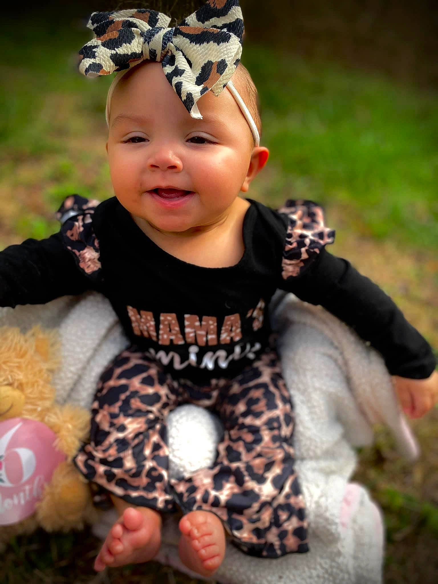 Azaria joined the competition — help win amazing prizes! baby, baby_toddler_clothing, child, eye, fawn, finger, flash_photography, fun, grass, happy, head, headpiece, headwear, jewellery, leaf, pattern, person, pink, plant, smile