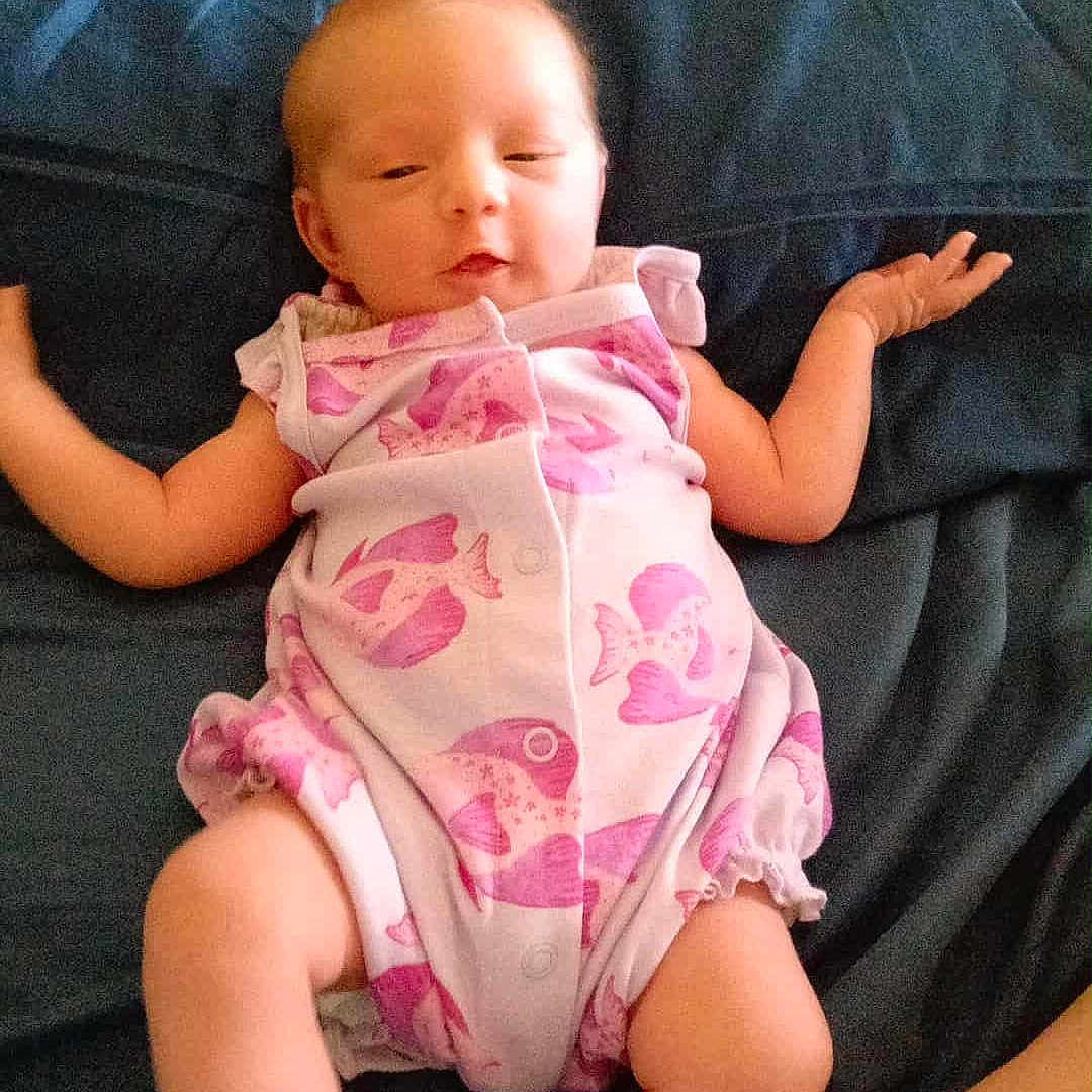 Aaliyahrose joined the competition — help win amazing prizes! arms_outstretched, baby, blanket, casual, child, comfort, content, cute, fish_pattern, home, infancy, infant, lying_down, newborn, onesie, pink, relaxed, skin, sleepy, soft