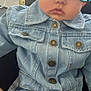 baby, denim_jacket, jeans, child, blue_eyes, face, sitting, indoor, window, furniture, curious, clothing, person, button, home, portrait, cute, casual, young_child, expression