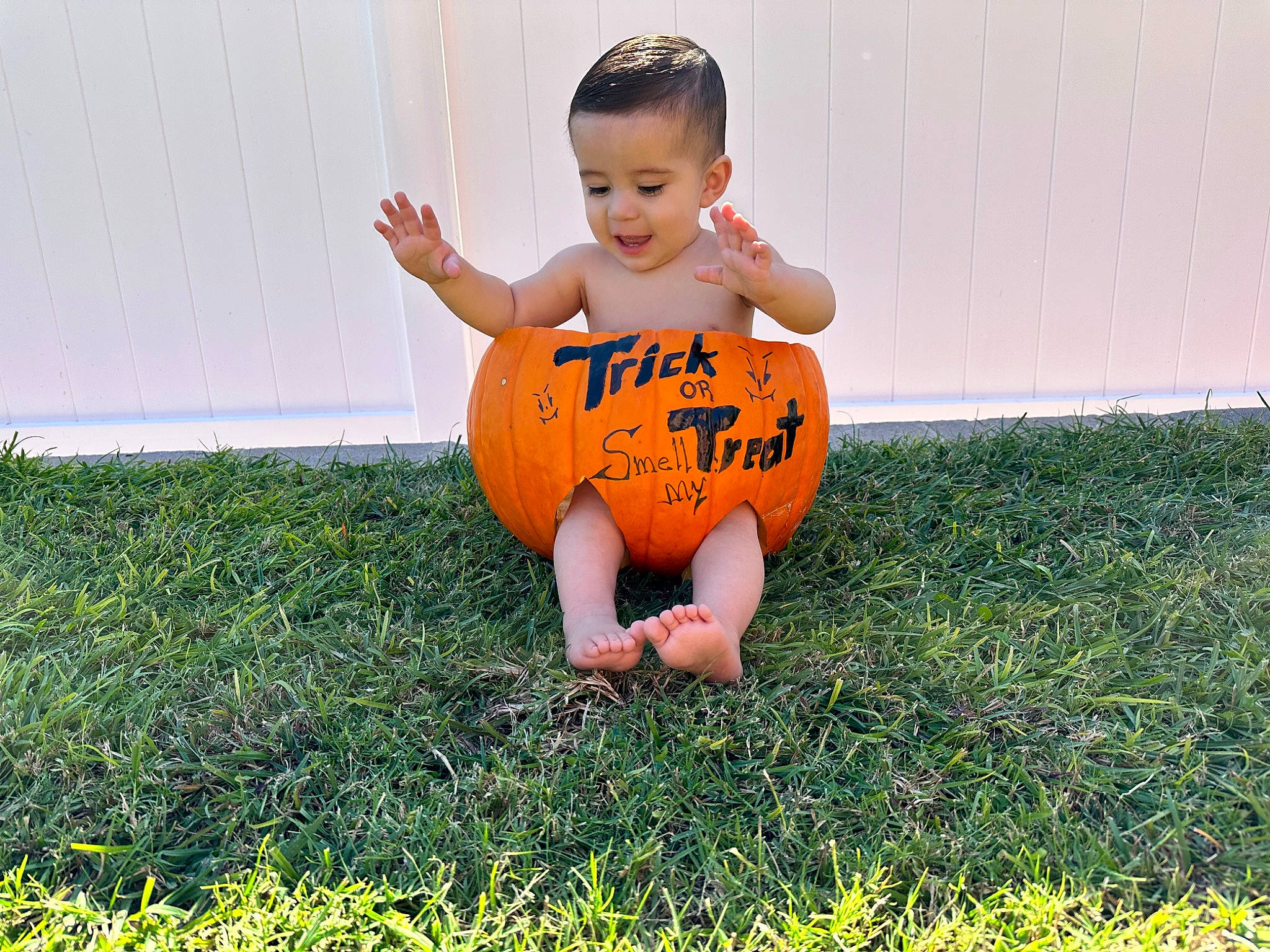 Rey is registered to the contest to win money with this photo: arm, baby, baby_toddler_clothing, eye, face, finger, flash_photography, football, grass, grass_family, hair, happy, head, people_in_nature, person, plant, playing_with_kids, recreation, smile, sports_equipment