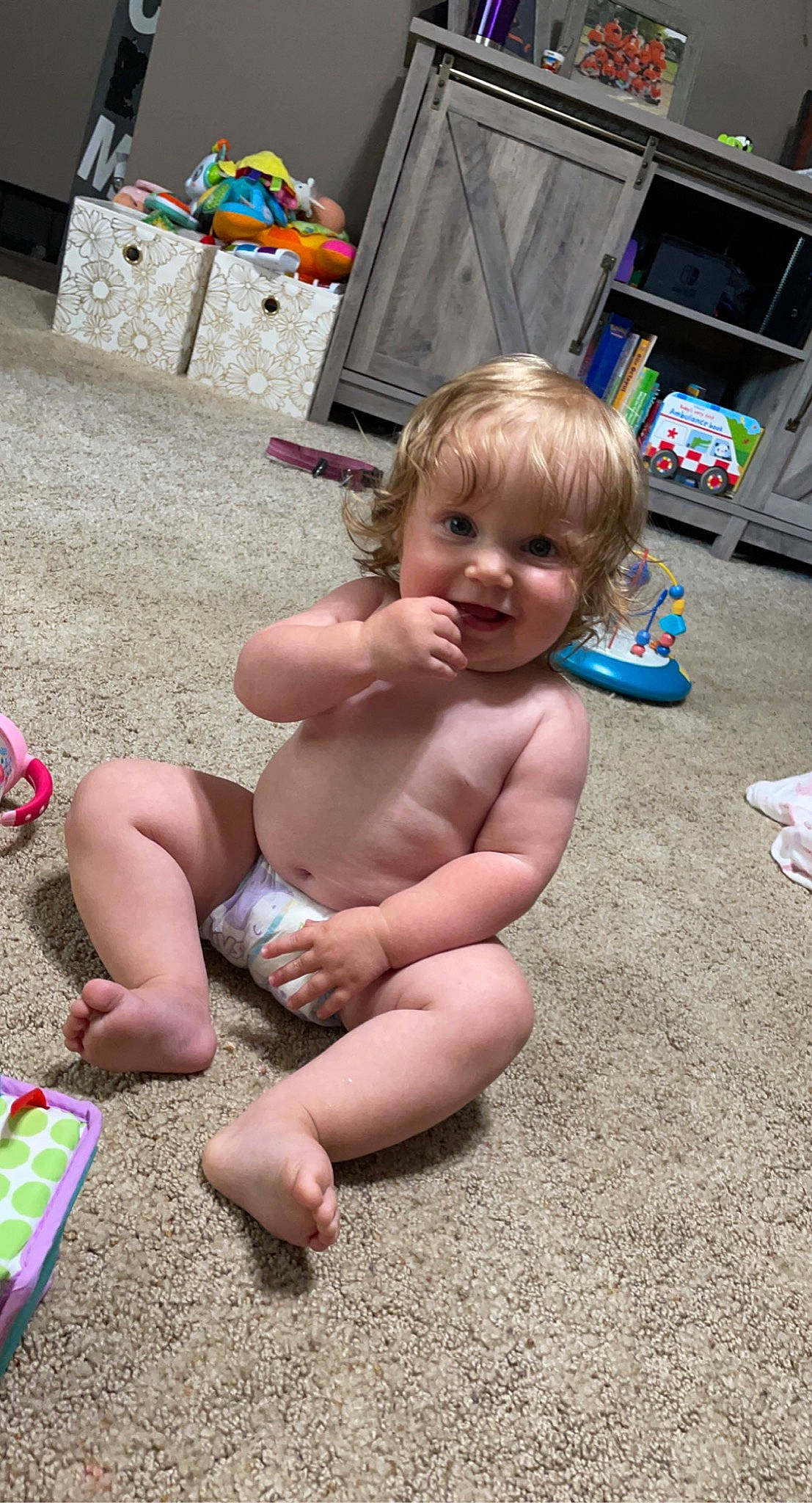 Jemma is registered to the contest to win money with this photo: baby, barechested, barefoot, child, event, foot, fun, happy, human_leg, joy, leisure, person, play, sand, sandal, sitting, smile, summer, thigh, toddler