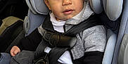 Myles is registered to the contest to win money with this photo: toddler, child, car_seat, seatbelt, gray_clothing, black_clothing, car_interior, sitting, safety, curious, young_child, baby, casual_wear, child_seat, infant, seatbelt_buckle, portrait, indoors, car, young_boy