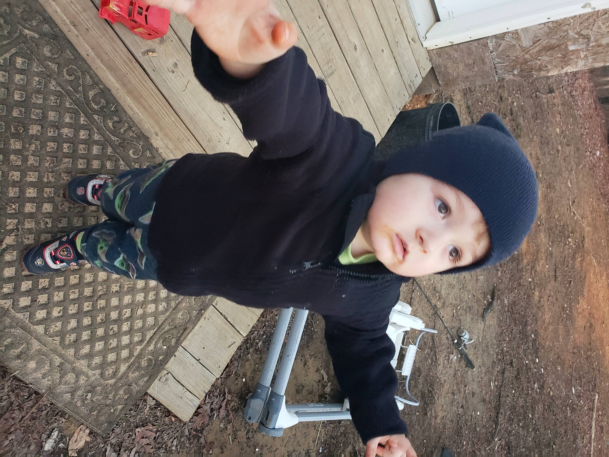 Edward is registered to the contest to win money with this photo: asphalt, child, cool, denim, fashion_accessory, flash_photography, flooring, fun, grass, hat, headwear, human_leg, person, road_surface, shadow, shoe, sitting, sneakers, sun_hat, t_shirt