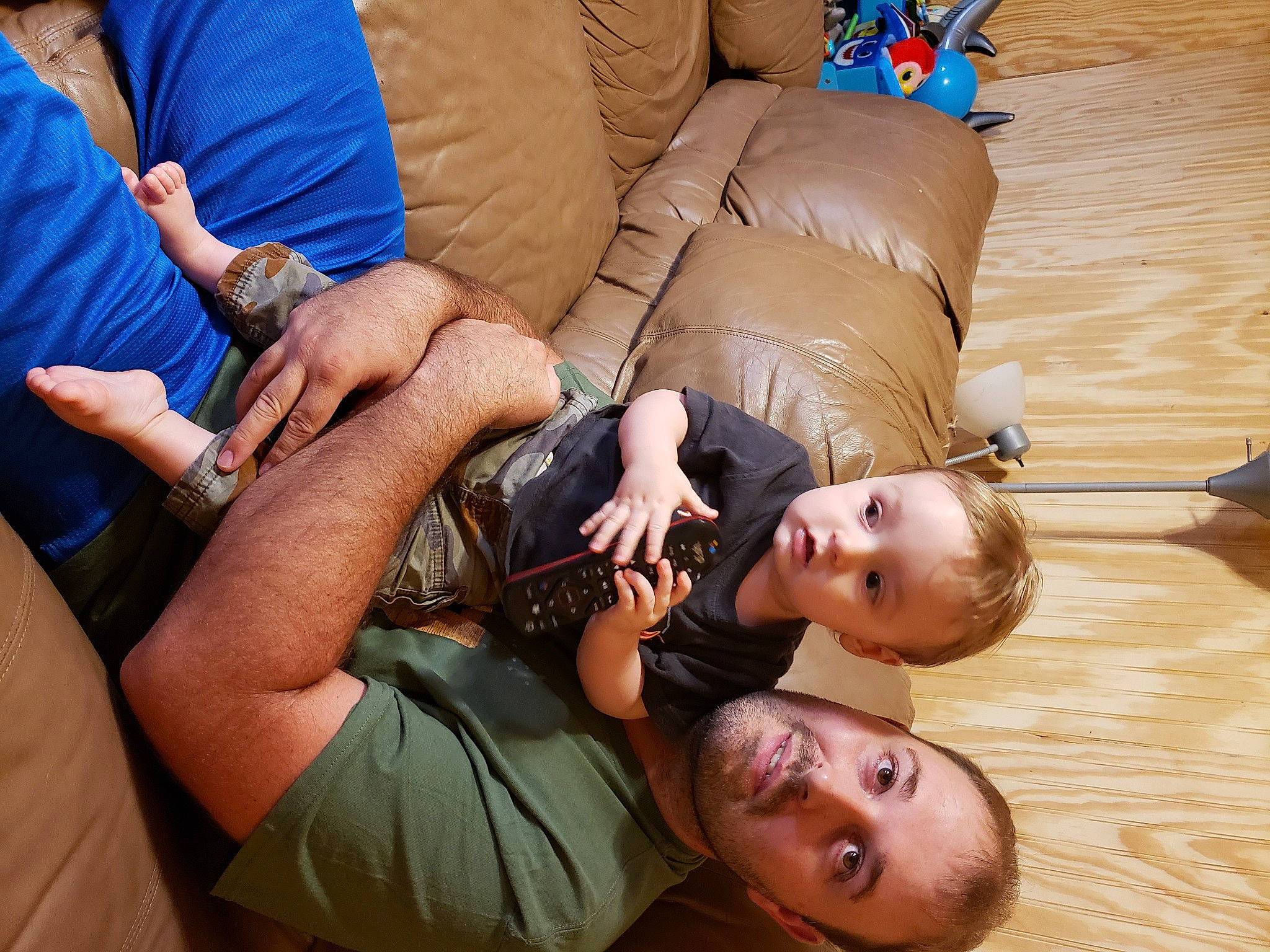 Edward is registered to the contest to win money with this photo: arm, comfort, elbow, finger, flooring, fun, gesture, hand, happy, joint, knee, mouth, muscle, nail, neck, person, thigh, thumb, toddler, wood