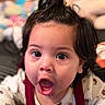 baby, child, face, expression, surprise, hair, black_hair, mouth_open, eyes, clothing, floral_pattern, indoors, portrait, closeup, cute, infant, person, skin, young, baby_girl