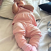 Amaryllis Perez joined the competition — help win amazing prizes! baby, bed, blanket, child, cozy, cute, flower, headband, home, indoor, infant, person, pillow, pink_clothing, relaxing, resting, sleeping, socks, soft, sunflower