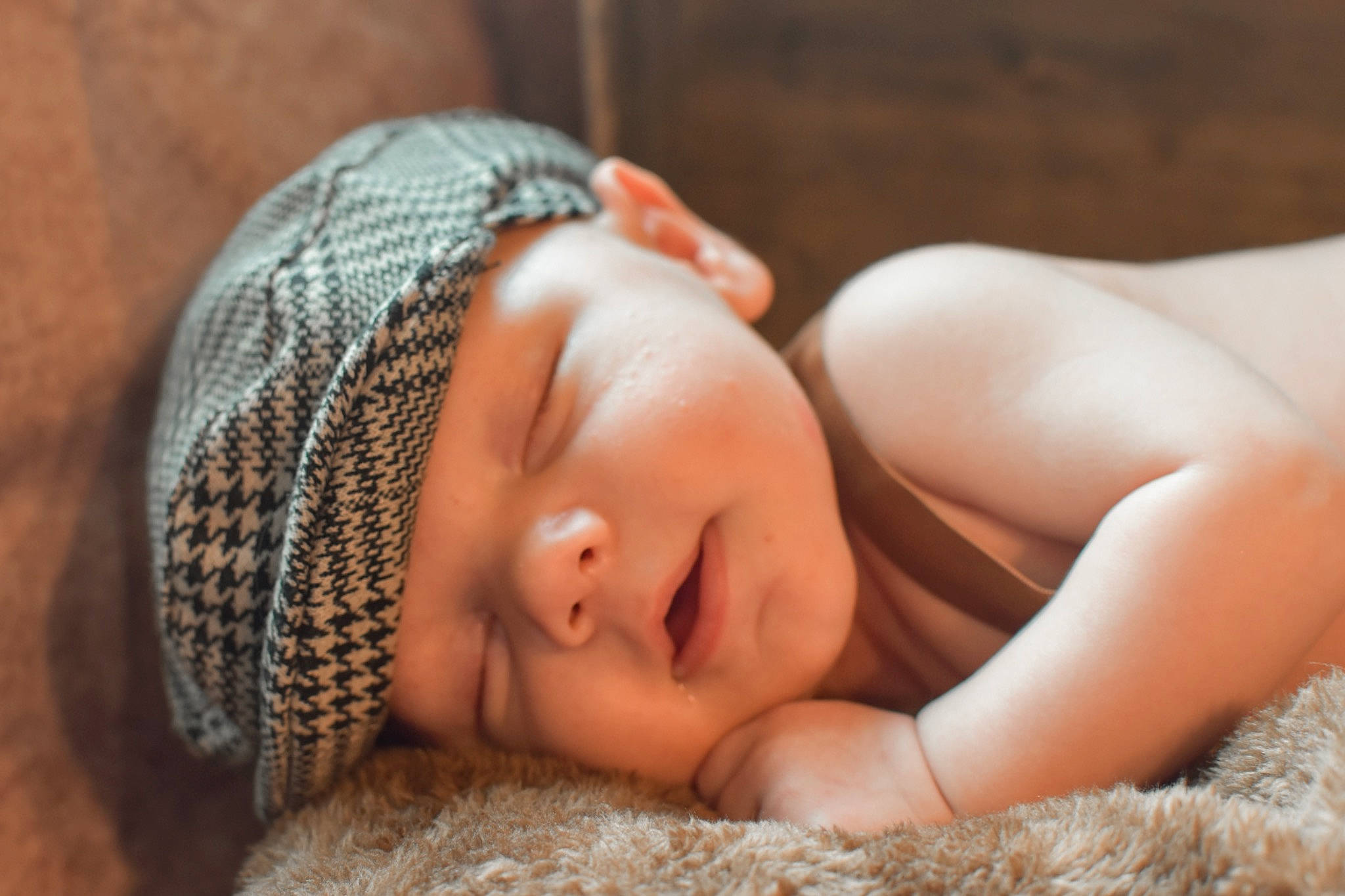 Jaxen is registered to the contest to win money with this photo: arm, baby, baby_sleeping, comfort, eye, eyebrow, eyelash, flooring, grass, happy, headband, headgear, headpiece, headwear, knit_cap, linens, lip, person, skin, textile