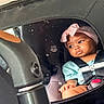 baby, child, infant, car_seat, vehicle, passenger, seatbelt, buckled, headband, pink, blue_shirt, sitting, portrait, face, eyes, curious, indoor, car_interior, travel_mug, safe