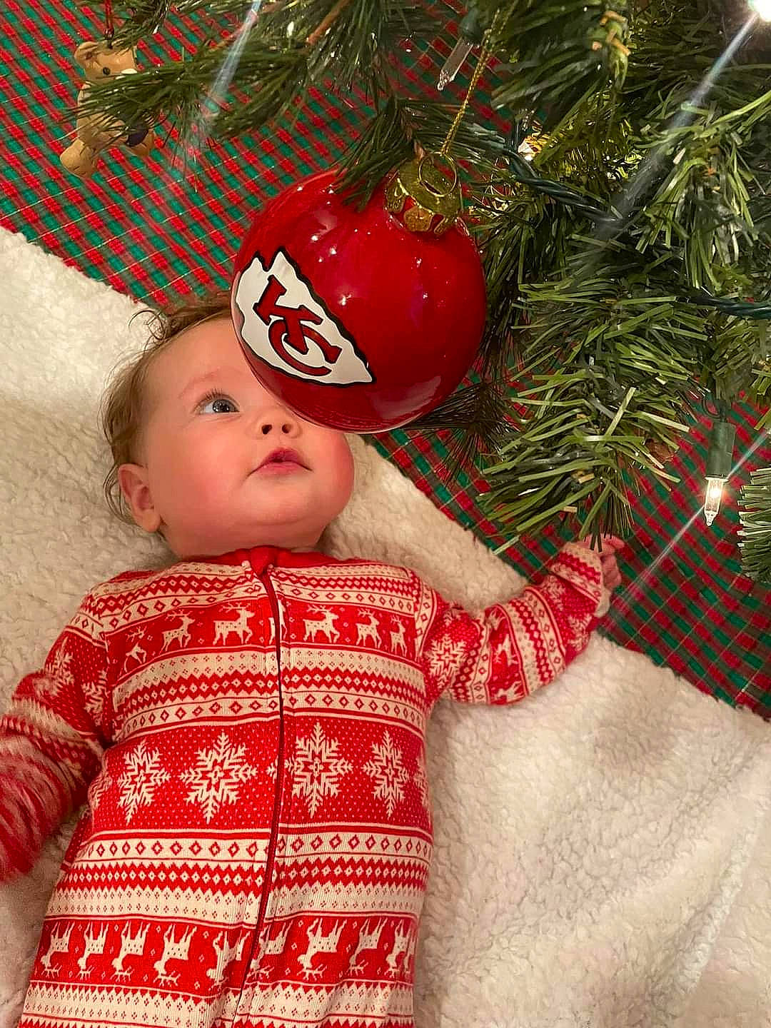 Oaklynn Mae is registered to the contest to win money with this photo: baby, baby_toddler_clothing, cap, child, christmas, christmas_decoration, christmas_ornament, christmas_tree, event, facial_expression, happy, head, holiday, holiday_ornament, human_body, ornament, person, plant, skin, sleeve