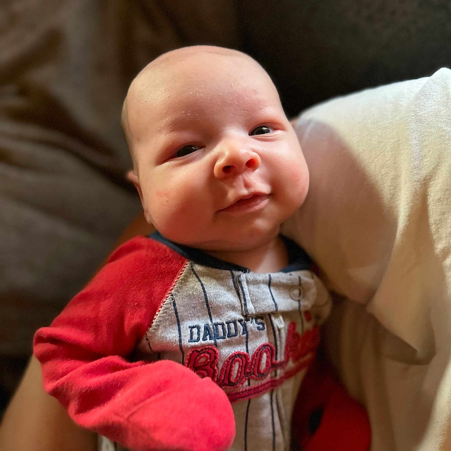 Jace joined the competition — help win amazing prizes! baby, bodypart, clothing, couch, cushion, face, finger, furniture, glove, happy, head, homedecor, knitwear, newborn, pants, person, photography, portrait, smile, sweater