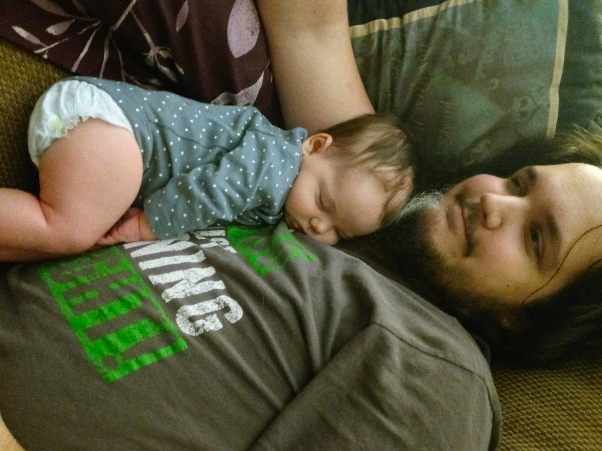 Heather is registered to the contest to win money with this photo: baby, baby_toddler_clothing, cheek, child, comfort, couch, eye, fun, gesture, grass, hairstyle, happy, human_leg, mammal, nap, person, sitting, sleeve, t_shirt, thigh