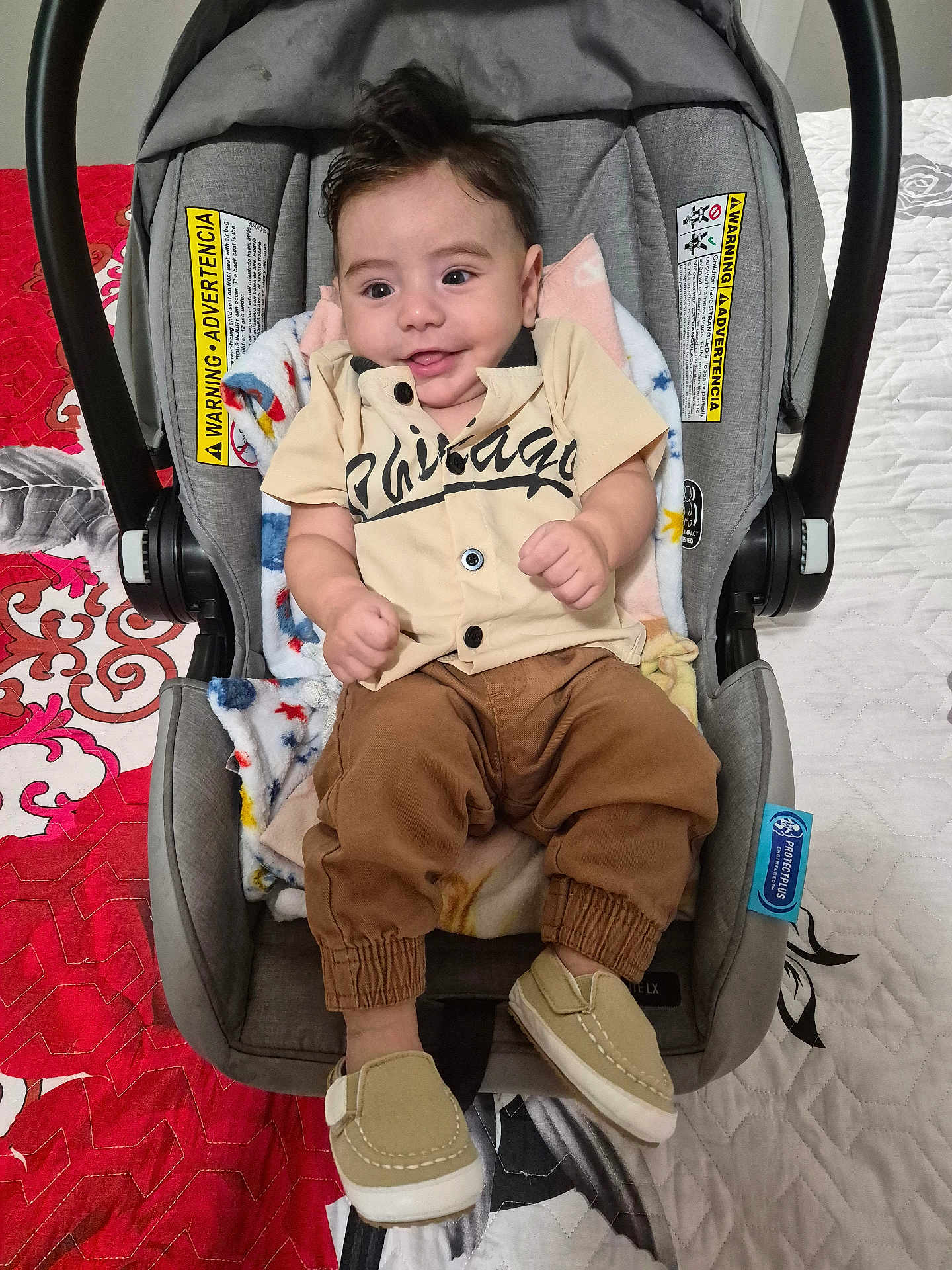 Thiago Garcias joined the competition — help win amazing prizes! baby, bedspread, blanket, car_seat, child, clothing, cute, fabric, footwear, happy, indoors, infant, pants, pattern, person, quilt, seat, shirt, shoes, smile