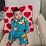 baby, child, armchair, pillow, hearts, mohawk, disney, goofy, pluto, mickey_mouse, shoes, clothing, indoor, cute, comfortable, person, portrait, textile, smiling, playful