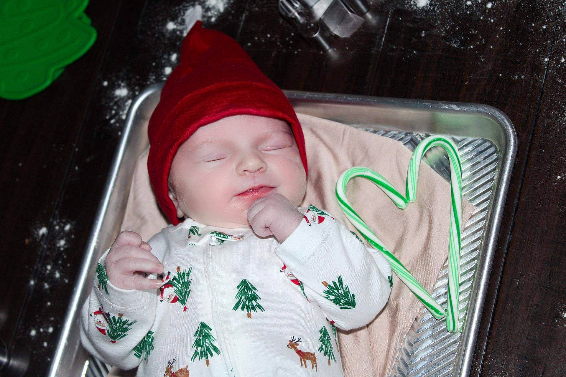 Emmett is registered to the contest to win money with this photo: baby, baby_carriage, baby_products, baby_safety, baby_toddler_clothing, bib, cap, carmine, cheek, child, comfort, fun, grass, happy, headwear, human_body, lip, person, pink, product