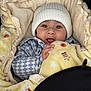 Gurniwaz joined the competition — help win amazing prizes! baby, blanket, checkered_clothing, child, cozy, cute, expression, face, hands, happy, hat, indoor, infant, knit_hat, person, portrait, smiling, soft_texture, warm, yellow_blanket