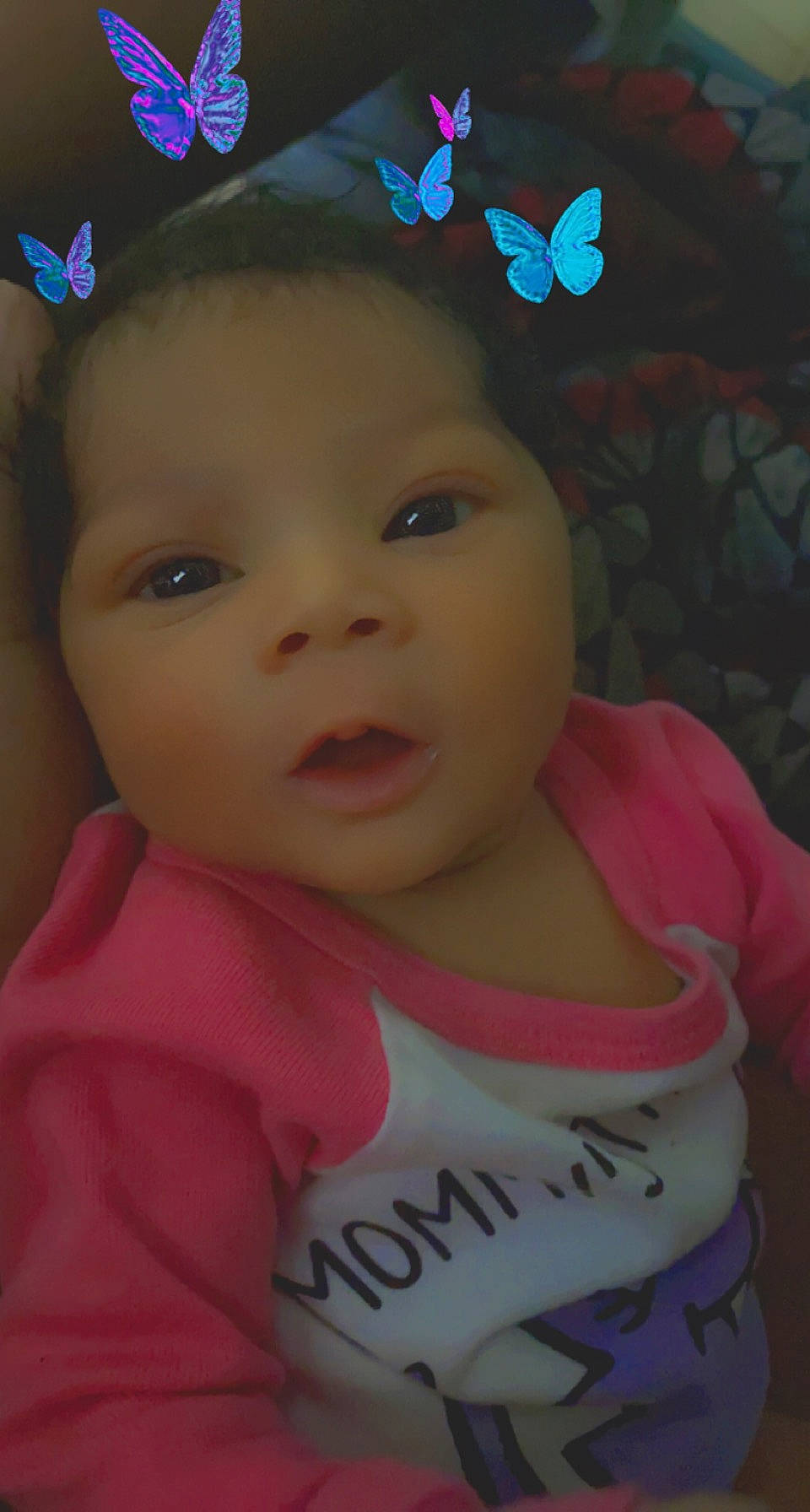 Avianna is registered to the contest to win money with this photo: baby, baby_toddler_clothing, black_hair, cap, cheek, ear, eye, eyebrow, eyelash, forehead, happy, iris, lip, nose, organ, person, pink, skin, sleeve, smile