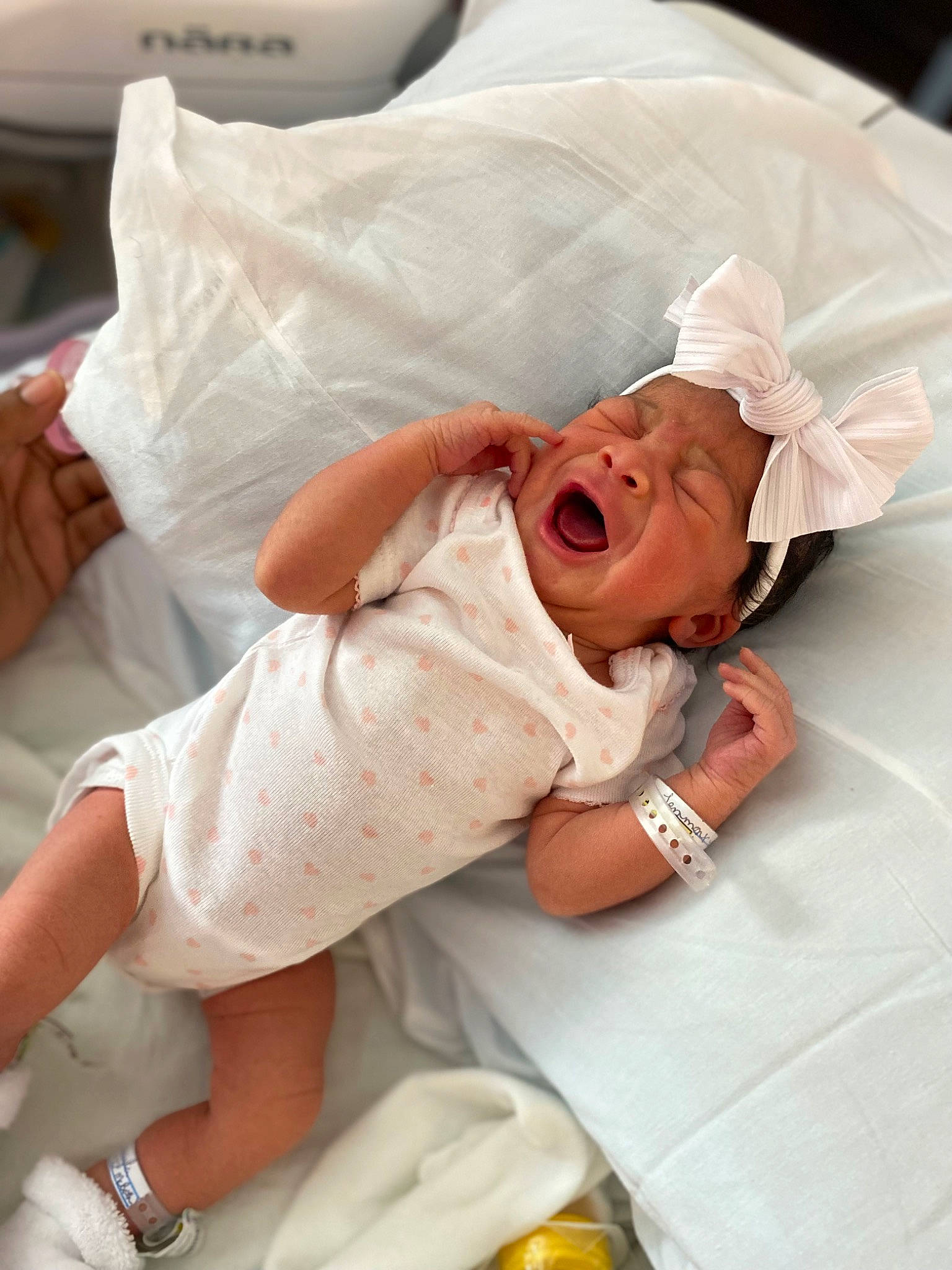 Avianna is registered to the contest to win money with this photo: baby, bed, bedding, comfort, event, headwear, health_care, hospital, hospital_bed, knee, leg, linens, medical, medical_equipment, patient, person, pillow, service, skin, smile