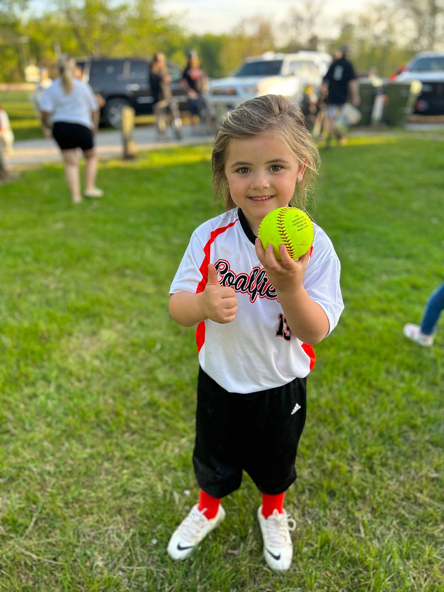 Willow joined the competition — help win amazing prizes! athlete, ball, blond, competition_event, facial_expression, fun, grass, grassland, happy, joy, leisure, people_in_nature, person, player, recreation, shorts, smile, sneakers, sports, sports_equipment