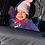 baby, beanie, bonnet, cap, car, car_interior, carseat, clothing, couch, face, furniture, glove, hat, head, hood, person, photography, portrait, transportation, vehicle