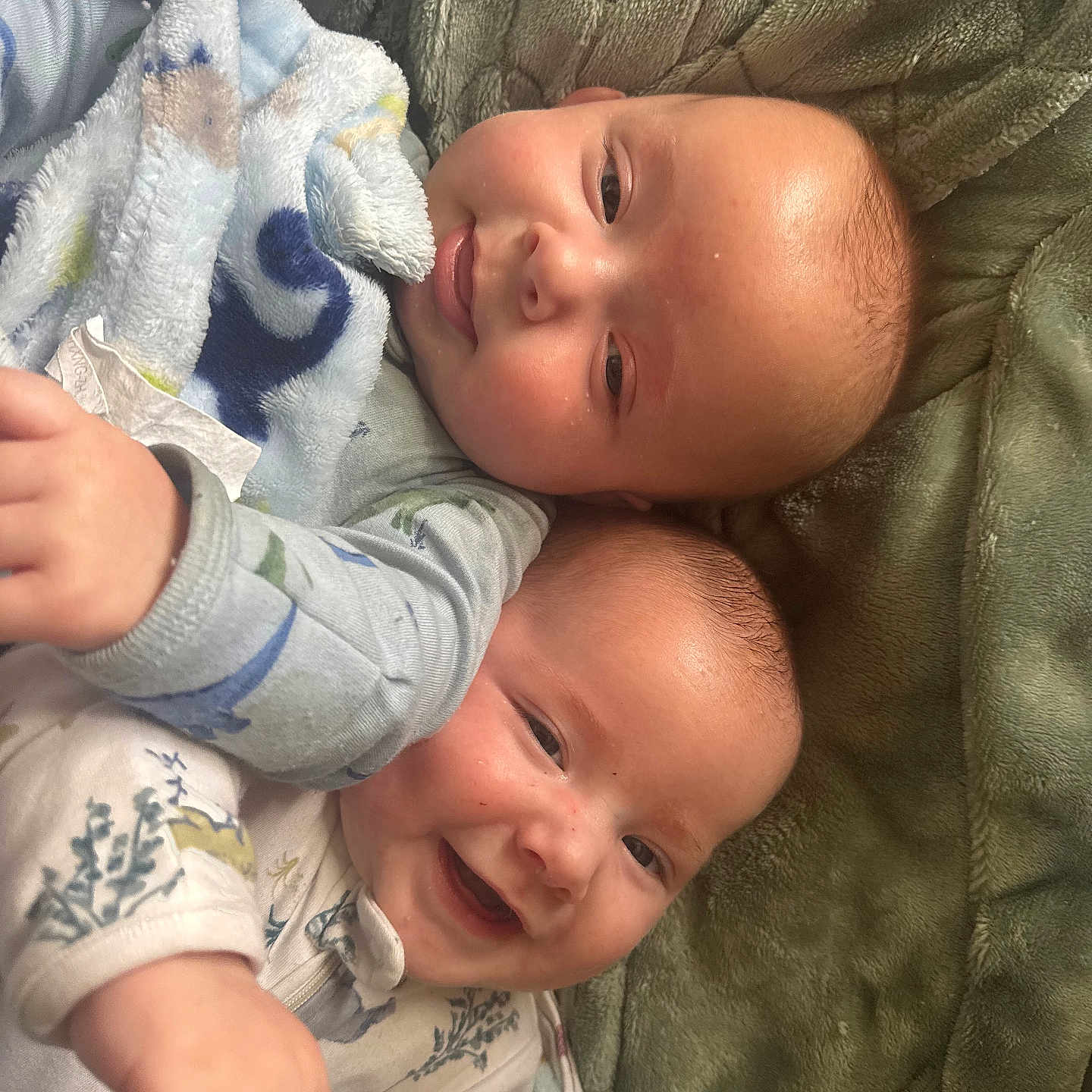 Devin And Drake Erb is registered to the contest to win money with this photo: baby, blanket, child, clothing, comfort, cute, fabric, face, happy, head, indoor, infant, lying_down, portrait, skin, smiling, soft, texture, together, warm