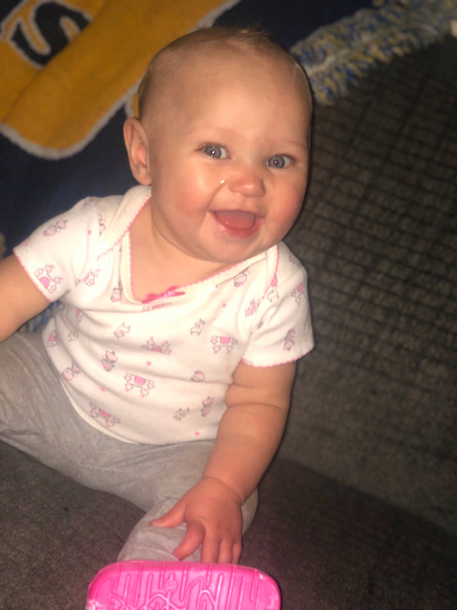 Calanah is registered to the contest to win money with this photo: baby, cheek, child, eye, face, fun, head, iris, joy, person, pink, play, sitting, skin, smile, toddler, vacation