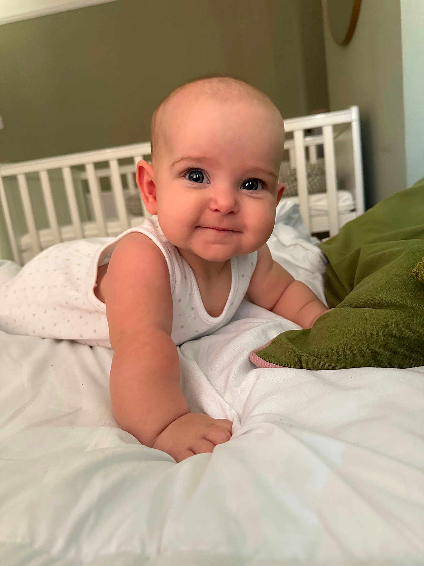 Romee joined the competition — help win amazing prizes! baby, infant, child, bed, white_bedding, pillow, crib, arm, face, skin, cute, smile, indoor, room, furniture, person, closeup, sleepwear, head, expression