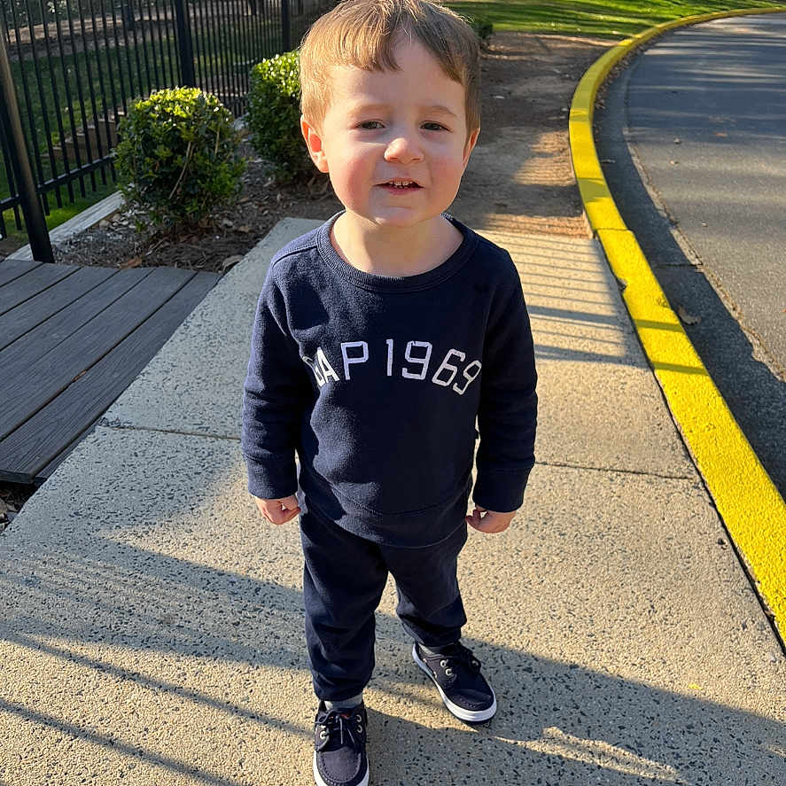 Braylen joined the competition — help win amazing prizes! bodypart, boy, child, clothing, face, finger, footwear, hand, head, longsleeve, male, pants, path, person, photography, portrait, road, shoe, sidewalk, sleeve