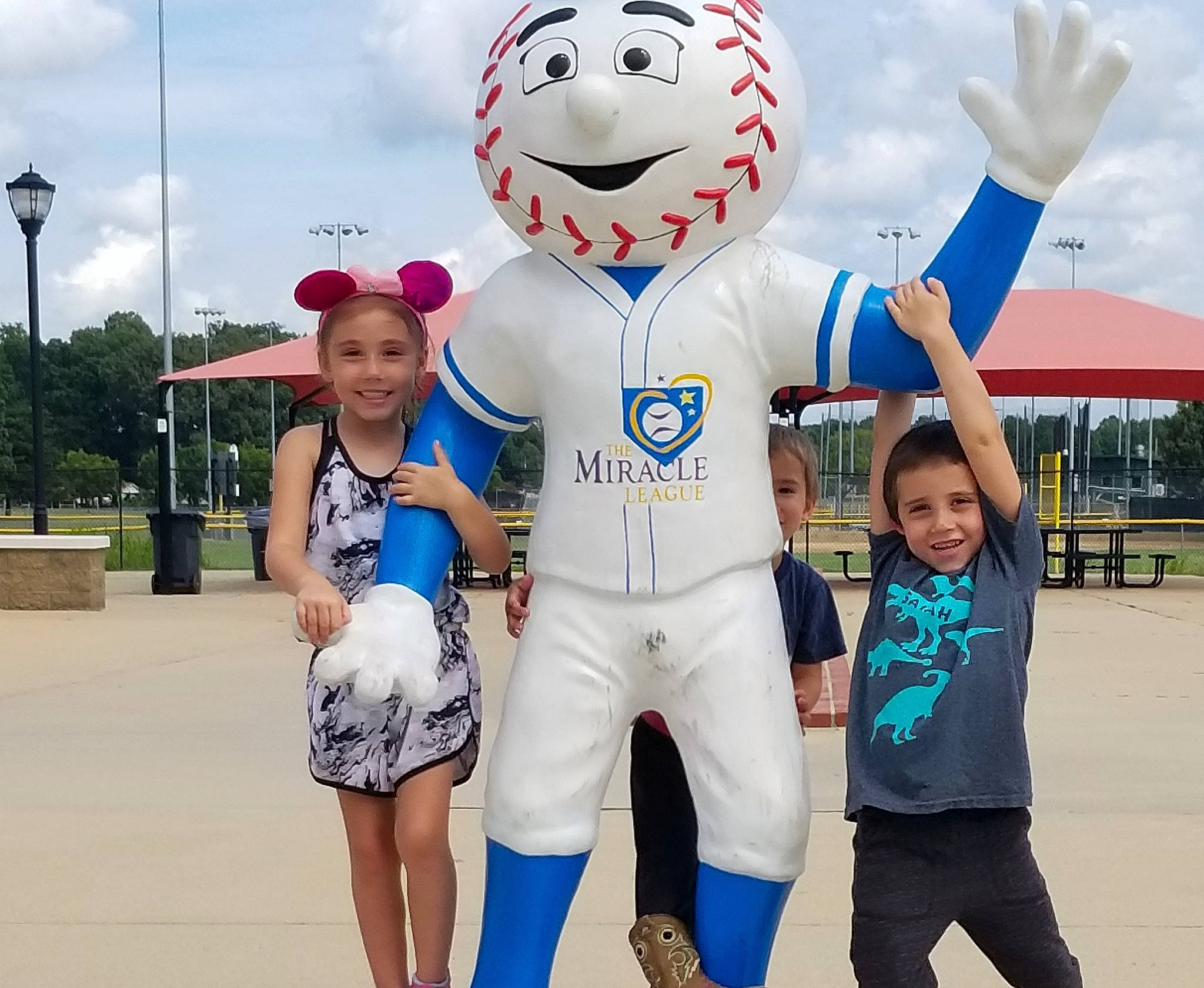 Zyriah joined the competition — help win amazing prizes! cloud, electric_blue, event, fun, gesture, happy, hat, headwear, inflatable, joy, leisure, mascot, person, recreation, shorts, sky, smile, street_light, t_shirt, toddler