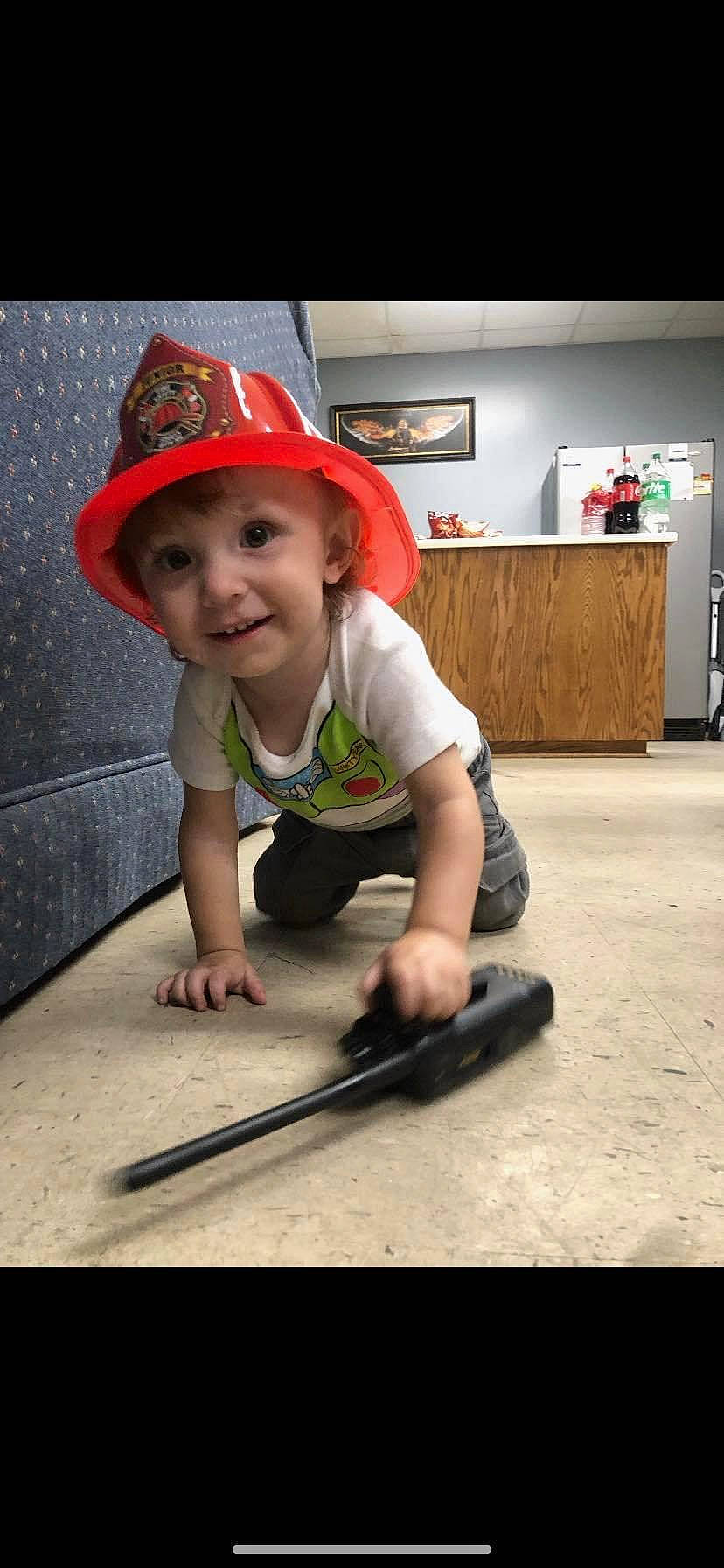 Colten joined the competition — help win amazing prizes! baby, baby_toddler_clothing, cap, child, costume_hat, fashion_accessory, flooring, fun, hat, headgear, headwear, joy, office_supplies, person, personal_protective_equipment, shorts, smile, standing, sun_hat, t_shirt