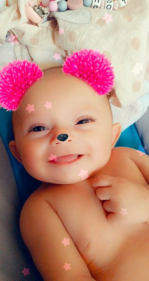 Lilou a rejoint le concours — aidez-le/la à gagner de superbes lots ! baby, cap, cheek, child, child_model, costume_accessory, eyebrow, face, fashion_accessory, fur, hair_accessory, head, headband, headgear, headwear, lip, mouth, person, pink, skin