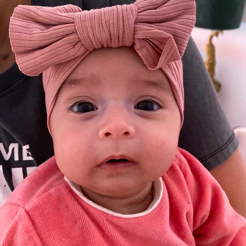 Giorgia participe au concours pour gagner de l'argent avec cette photo : accessories, baby, beanie, bonnet, cap, clothing, face, frown, happy, hat, head, headband, person, photography, portrait, sad, scarf, sleeve, smile, tape