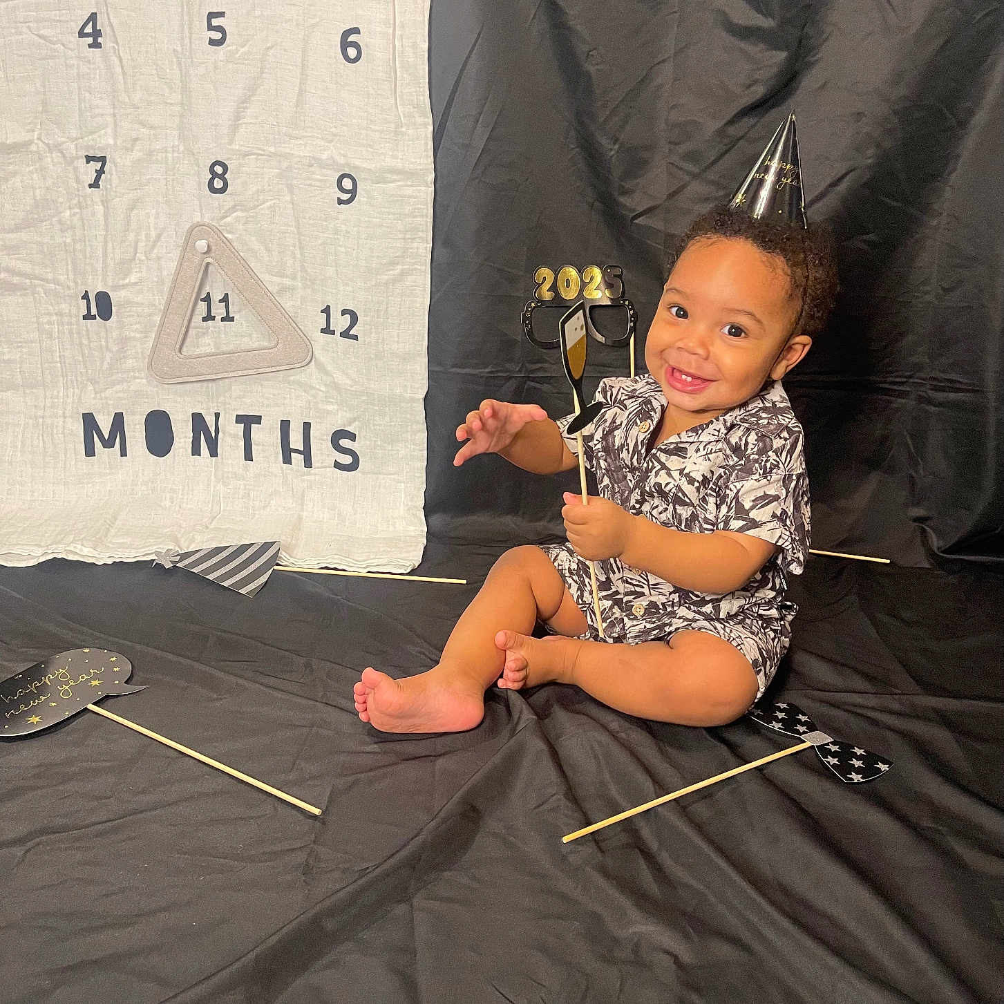 Aaron joined the competition — help win amazing prizes! baby, bodypart, clothing, couch, dress, electricaldevice, face, finger, footwear, furniture, hand, hat, head, indoors, microphone, person, photography, portrait, sandal, sitting