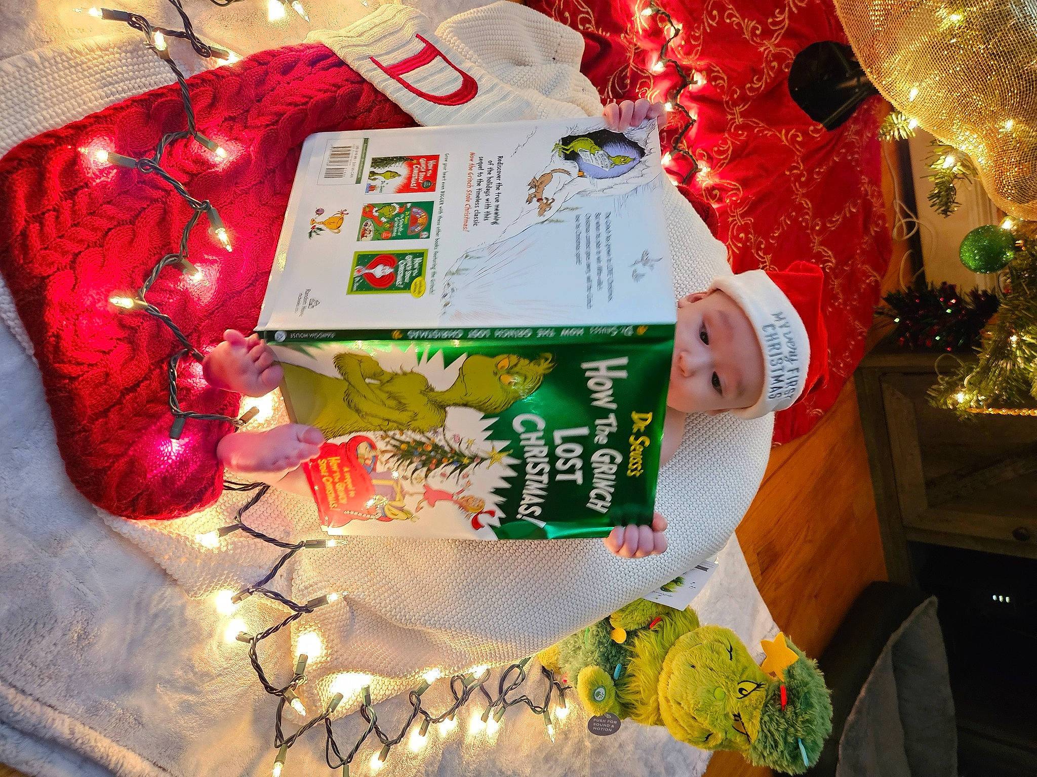 Dominic is registered to the contest to win money with this photo: carmine, christmas, christmas_decoration, christmas_eve, christmas_lights, christmas_ornament, decoration, event, happy, headwear, holiday, holiday_ornament, interior_design, light, ornament, person, present, tradition