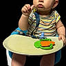 baby, child, high_chair, teether, carrot_toy, striped_shirt, blue_eyes, bare_feet, infant, cute, portrait, expression, sitting, hand, fingers, skin, face, indoor, isolated, background