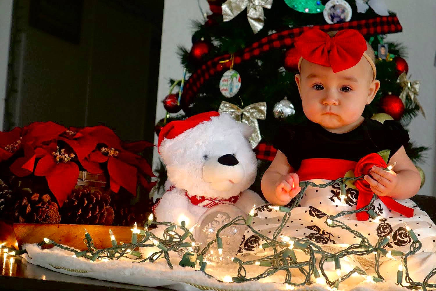 Mariah joined the competition — help win amazing prizes! baby, baby_toddler_clothing, carmine, christmas, christmas_decoration, christmas_eve, christmas_ornament, costume_hat, decoration, event, happy, hat, headwear, holiday, holiday_ornament, ornament, person, red, toy, tradition