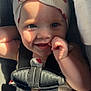 Everlyn joined the competition — help win amazing prizes! baby, child, smiling, hat, car_seat, seatbelt, sunlight, shadow, cute, face, blue_eyes, hand, infant, clothing, pattern, red, white, cheerful, portrait, closeup