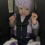 Everlyn joined the competition — help win amazing prizes! baby, car_seat, purple_headband, flower, blanket, straps, child, infant, seated, clothing, indoors, cute, safety, toddler, young_child, headwear, person, restraint, soft_lighting, closeup