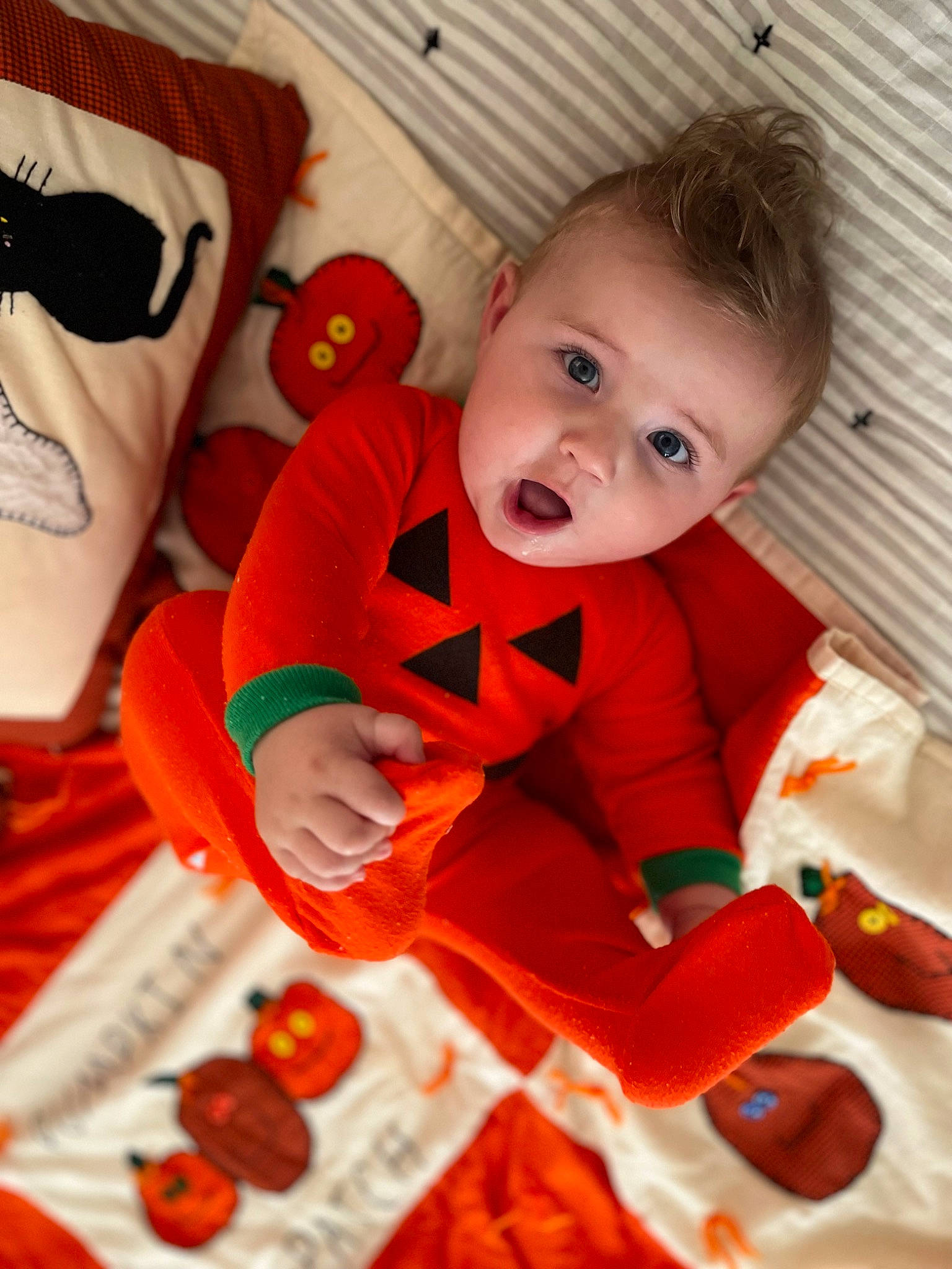 Brody is registered to the contest to win money with this photo: baby, baby_products, baby_toddler_clothing, baby_toys, carmine, cheek, child, comfort, flooring, fun, happy, linens, orange, person, play, product, red, room, surprise, textile