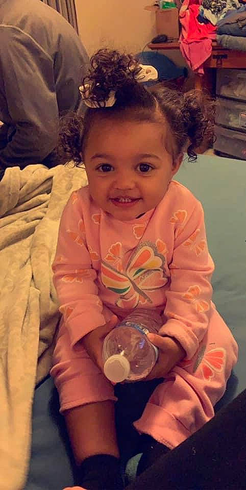 Gabby joined the competition — help win amazing prizes! baby, cheek, child, ear, eye, fun, hair_accessory, hairstyle, iris, joy, person, sitting, skin, smile, toddler