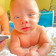 Ramontez joined the competition — help win amazing prizes! baby, infant, child, face, skin, arm, hand, blanket, indoor, furniture, chair, fan, expression, portrait, cute, person, closeup, soft, curious, lying