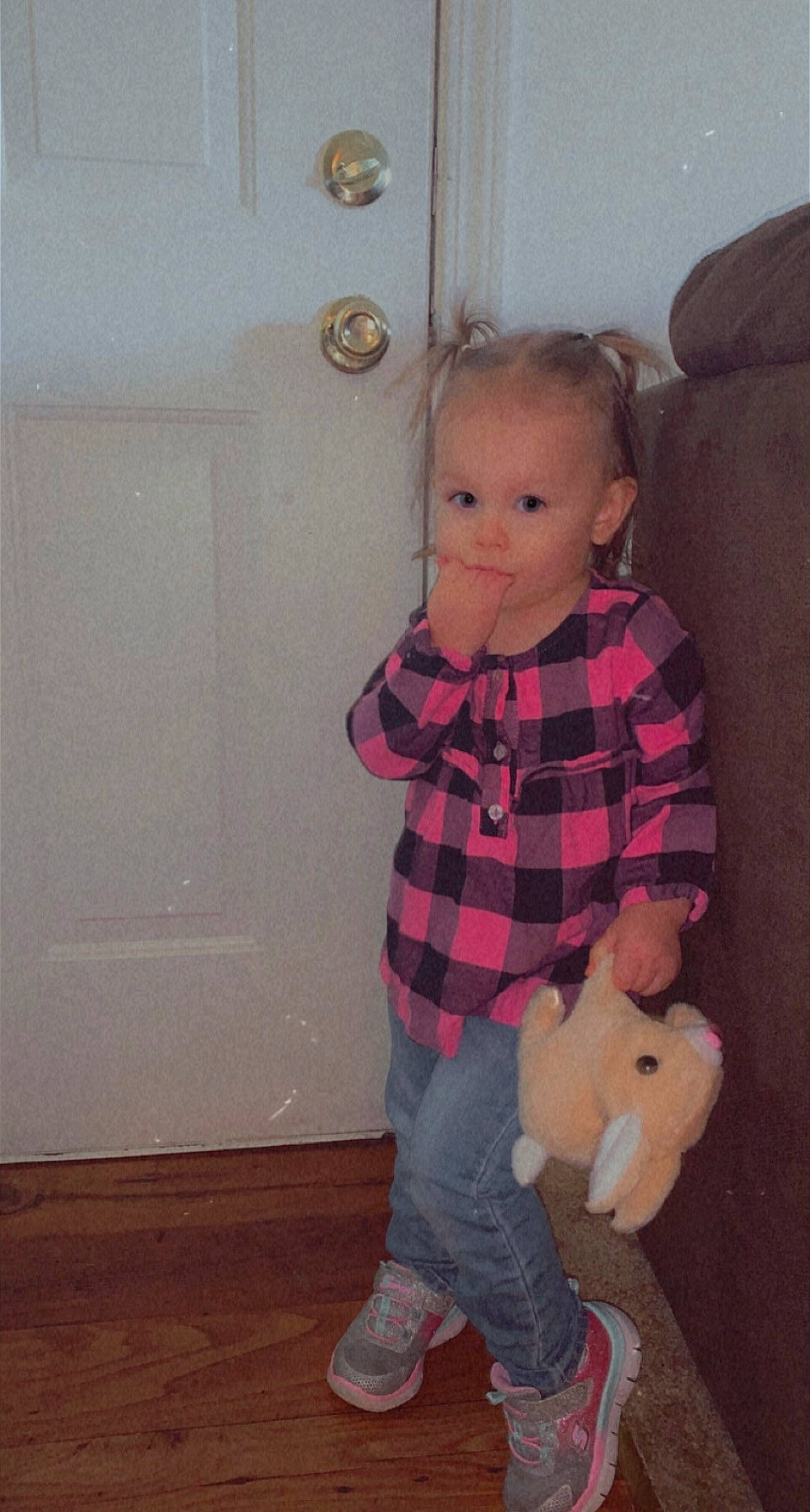 Karlee is registered to the contest to win money with this photo: baby, baby_toddler_clothing, door, eye, floor, flooring, fun, hardwood, human_leg, knee, mammal, pattern, person, plaid, sleeve, tartan, toddler, toy, trunk, waist