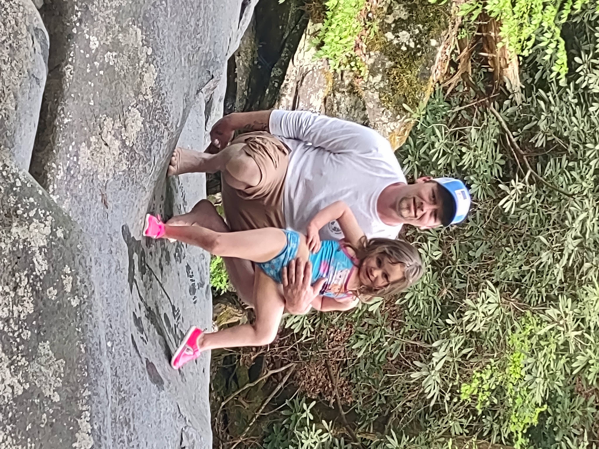 Kilah is registered to the contest to win money with this photo: adventure, child, climbing, fun, grass, happy, headwear, joy, landscape, leisure, people_in_nature, person, plant, recreation, rock, rock_climbing_equipment, rope, shorts, smile, sport_climbing