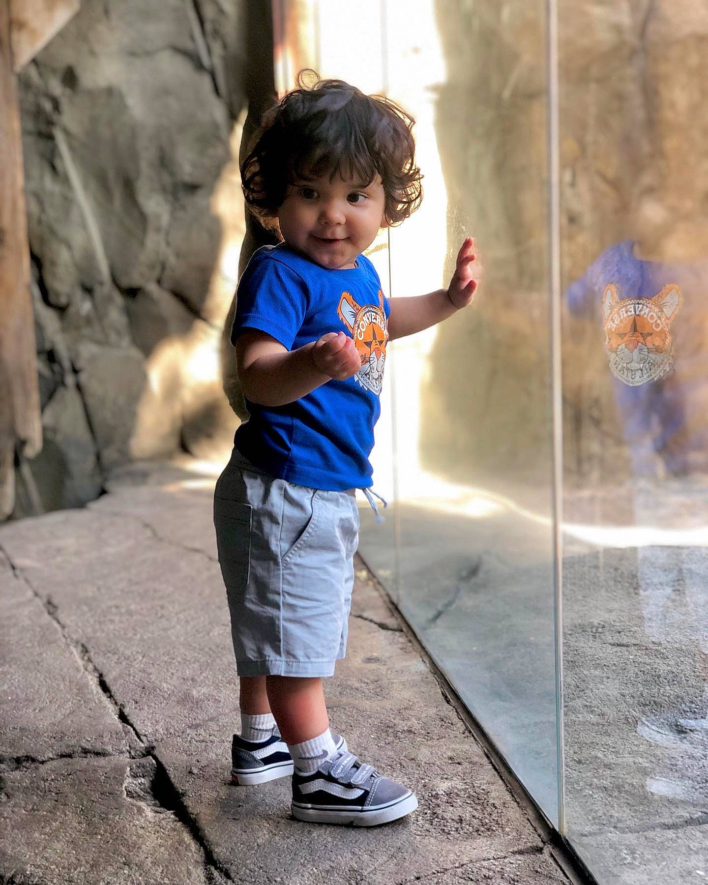 Randy is registered to the contest to win money with this photo: child, concrete, electric_blue, fountain, fun, happy, leisure, person, recreation, rock, shadow, sitting, smile, standing, street, t_shirt, toddler, tourism, travel, vacation